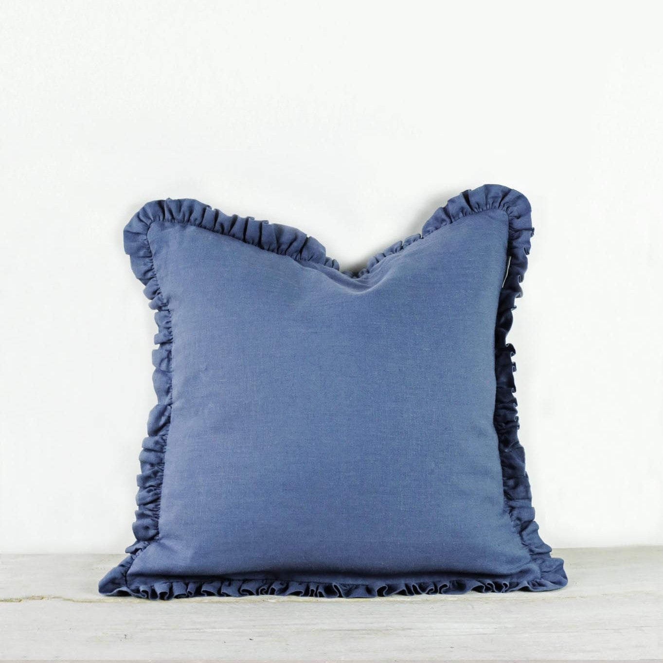 Blue shop ruffle pillow